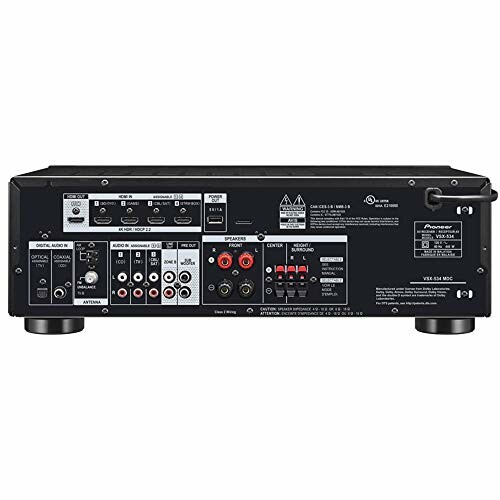 Back panel of an audio receiver with various input and output ports.