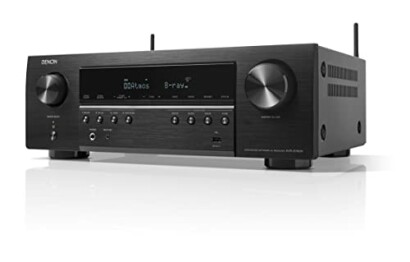 Denon AV receiver with various controls and display.