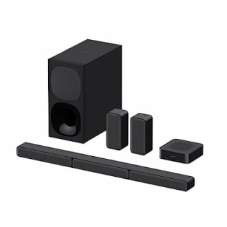 Home theater speaker system with subwoofer, soundbar, and speakers.
