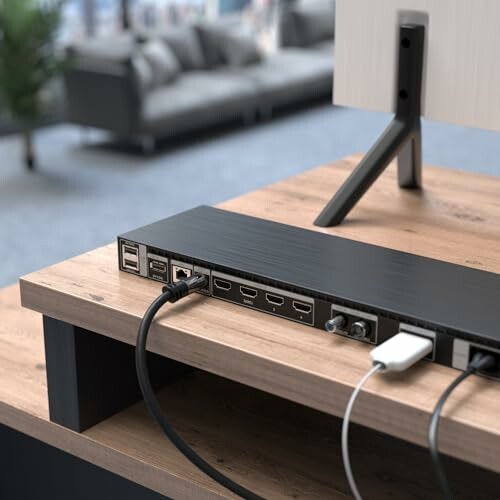 Back view of monitor showing connected cables and ports.