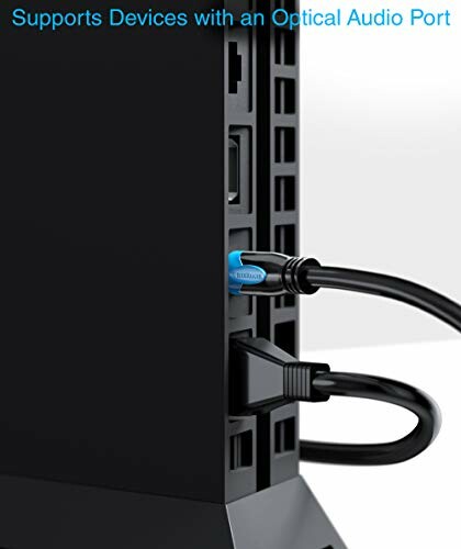 Close-up of a device with optical audio port connection.
