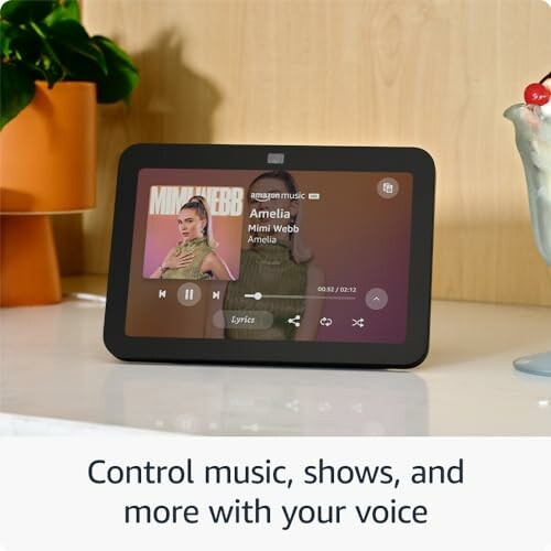 Smart display controlling music with voice command.