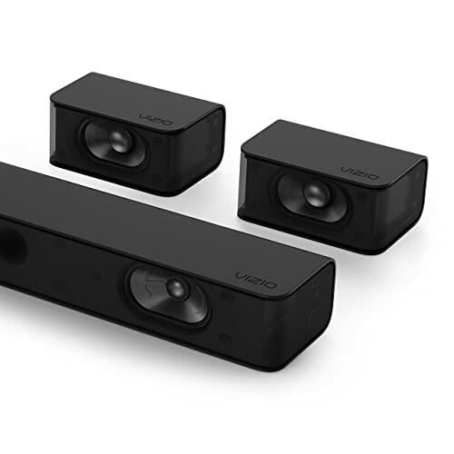 Vizio soundbar and two satellite speakers enhancing a home theater setup.