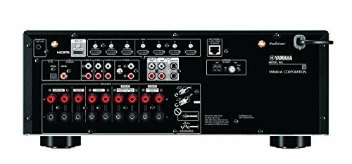 Back panel of a Yamaha audio receiver with various input and output ports.